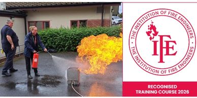Person using fire extinguisher during fire safety training by Institution of Fire Engineers.