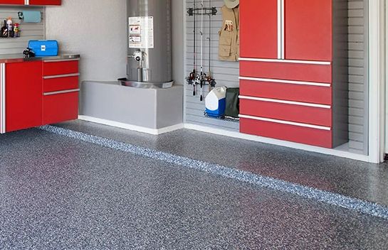 garage cabinets installed off the ground for easier cleaning of garage floor