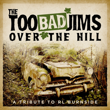 Album cover featuring an old rusty car in a forest.