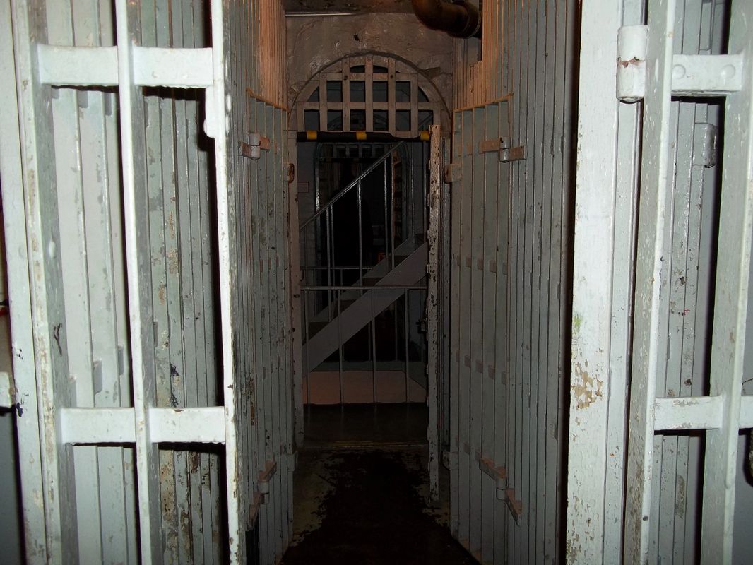 Iconic shot taken by investigator John R.  A shadow figure stands in the Legacy cell, back to us