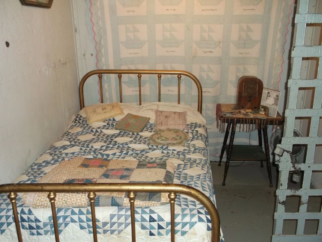 The legacy cell - the shadow figure stood right here at the foot of the bed. Open cell door to the right looks across the hall to juvenile cells. 