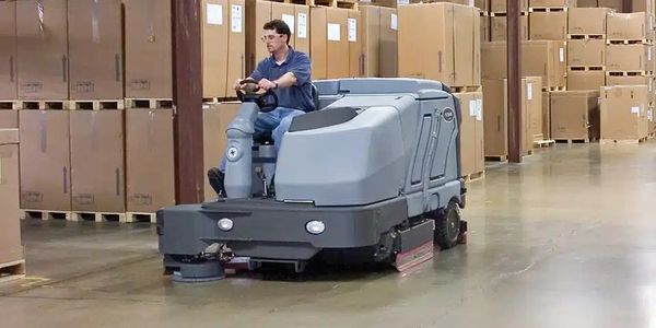 Ride-on Floor Scrubber Cleaning a warehouse