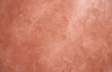 Textured brown plaster wall.