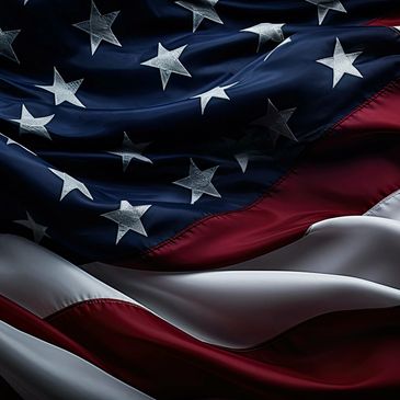 Close-up of the American flag with visible stars and stripes.