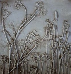 Hand-finished botanical plaster relief artwork with refined texture and pattern detail for quiet interior spaces