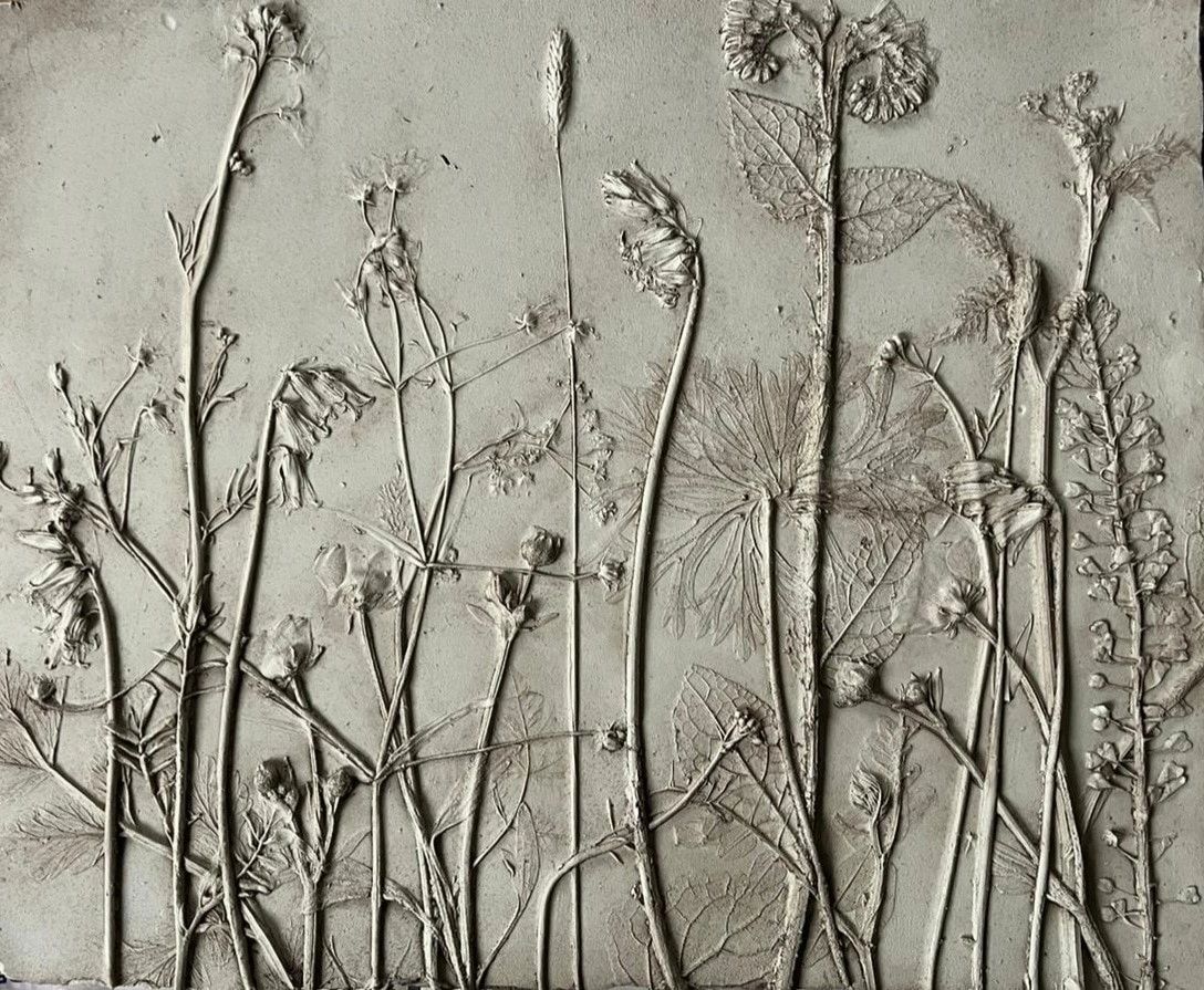 Close-up pressed botanical surface relief artwork showing intimate plant details with archival quality and soft textured finish