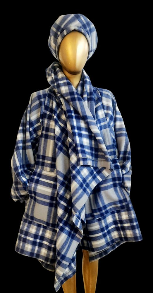 Mannequin dressed in blue and white plaid coat with matching scarf and turban.