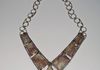 Shaped fossilized coral cabochons are joined together with sterling silver wire.  The chain and “S” hook are also handmade