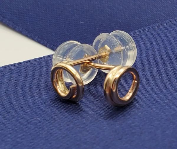 Gold stud earrings