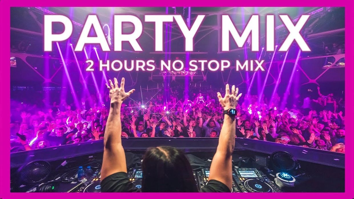 DJ performing a 2-hour nonstop party mix in front of a lively crowd.
