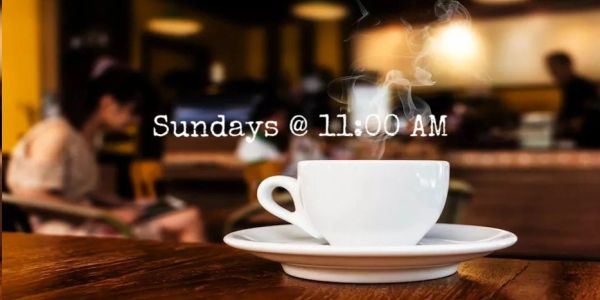 Steaming coffee cup with text 'Sundays @ 11:00 AM' in a cozy cafe.