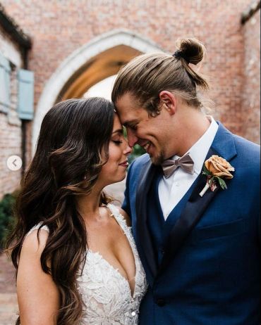 Couple sharing an intimate moment on their wedding day.