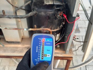 Confirming failed AC compressor using Megohmmeter. 