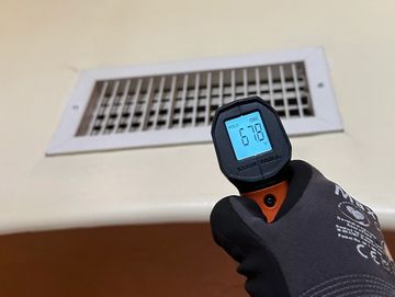 Checking AC supply temperature.