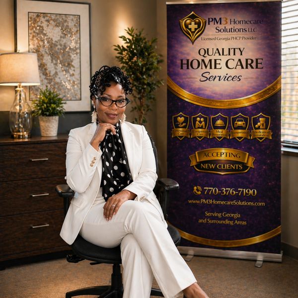Professional woman in white suit sits confidently beside home care services banner.