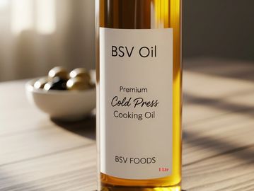 Bottle of BSV Oil, premium cold press cooking oil, on a wooden surface.