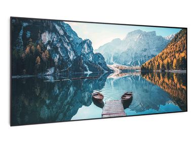 Scenic mountain lake with two boats and a wooden dock.