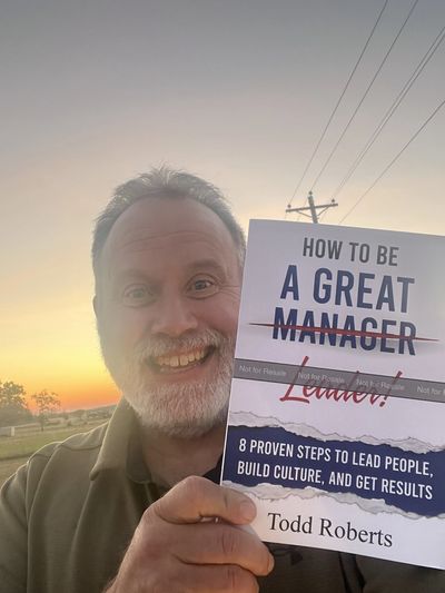 Author Todd Roberts unpacking his very first proof copy of How to Be A Great Leader.