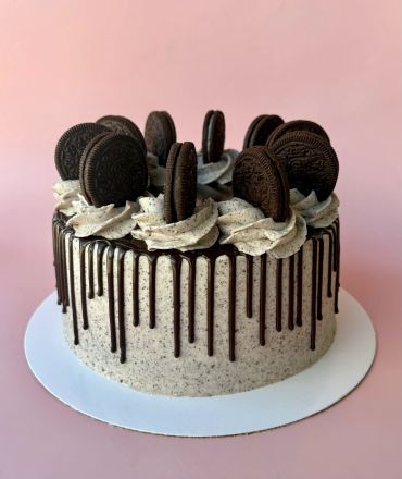 Cookies and cream drip cake with Oreo toppings.