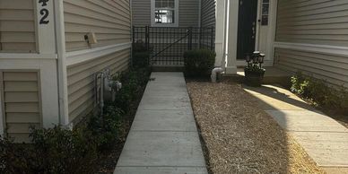 Concrete sidewalk replaced and straw blanket