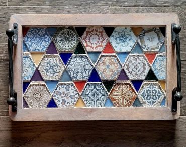Decorative tray with colorful hexagonal tiles.