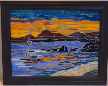Mosaic art of a sunset over water with boats.