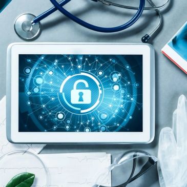 Tablet displaying a digital lock icon with medical tools around it.