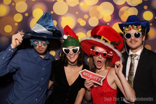 Excited event guests posing with props
