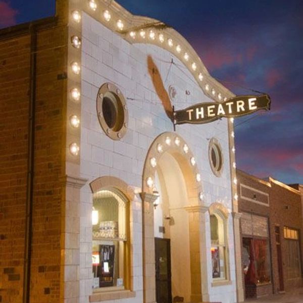 Hippodrome Arts Centre. Vintage theater building illuminated at dusk.
