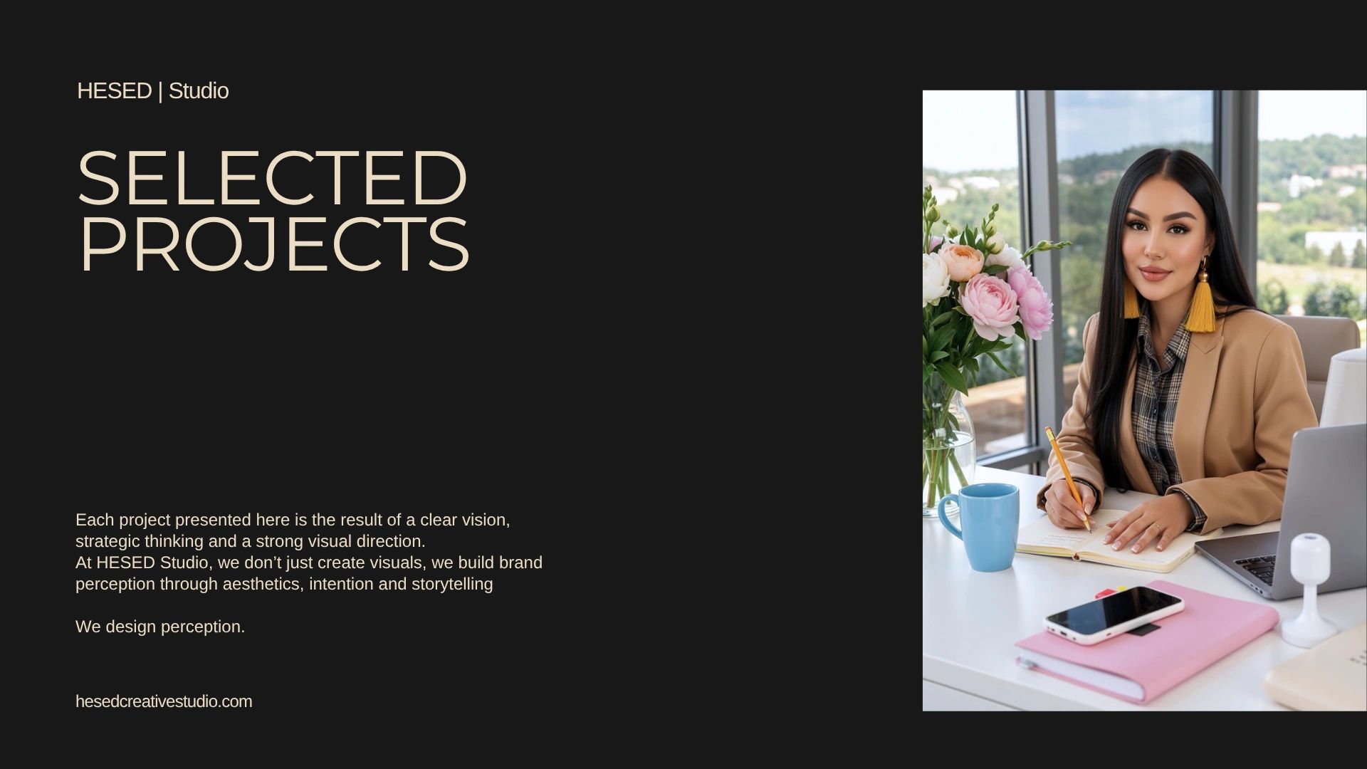 Professional woman working in a bright office setting with flowers and technology.