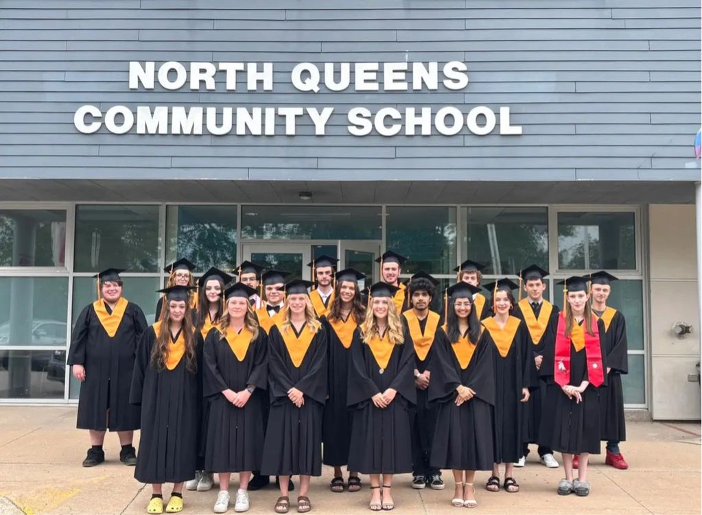 Class of 2025. Group photograph taken outside the main entrance to the school.