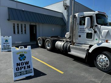 Mattress hauling truck parked outside of RRS ID located in Garden City, ID