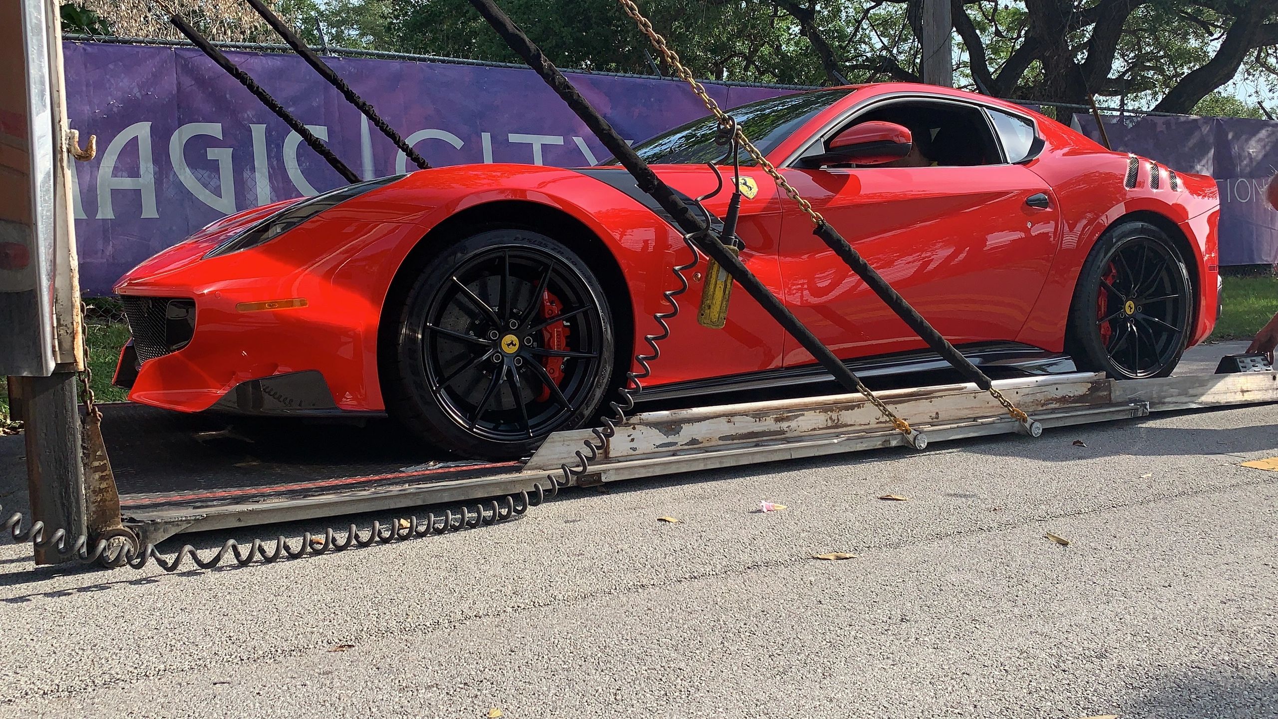Exotic Car Transport being loaded into an enclosed trailer headed for Miami Florida