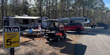 RVs and golf cart at Apple Country RV Resort, scenic Georgia camping spots