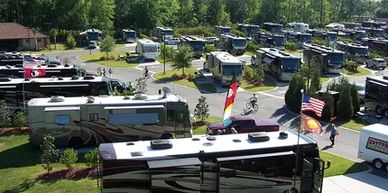 Aerial view of RVs parked across the spacious and well-kept Coastal Georgia RV Resort.