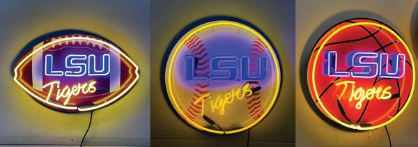 Three LSU Tigers neon signs for football, baseball and basketball.