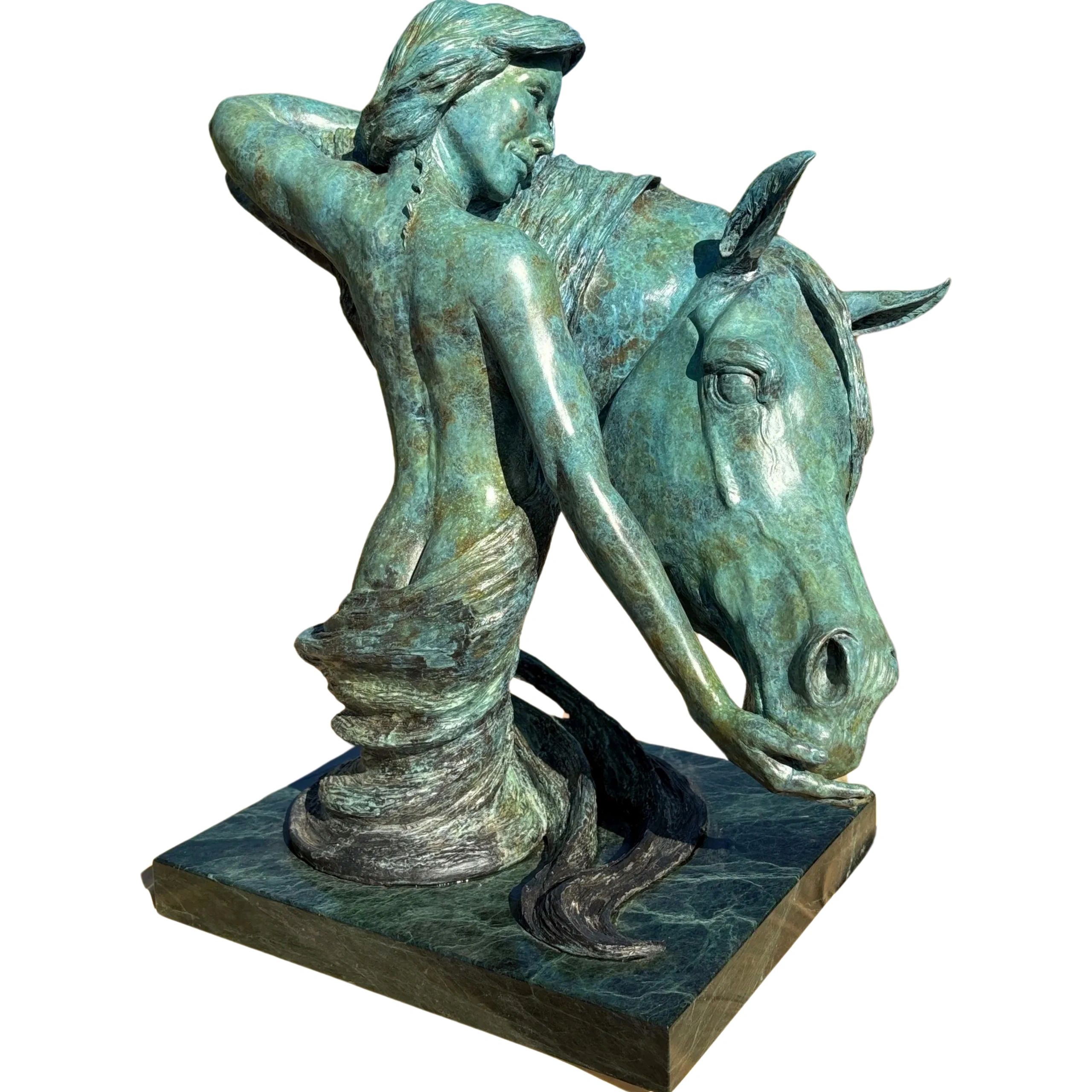 Bronze sculpture of girl and horse. Suitable for either indoors or ourtoor display. 