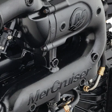 Close-up of a black MerCruiser engine part.