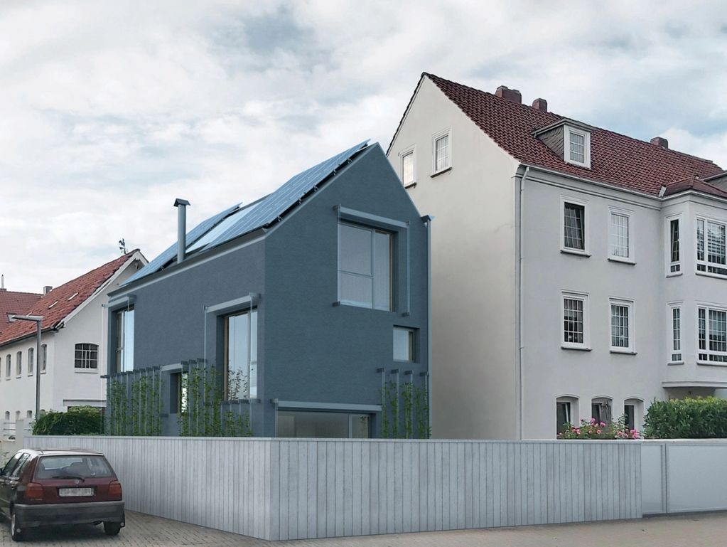 Modern house with solar panels in a residential area.