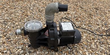 Compact swimming pool water circulation and filtration pump unit.