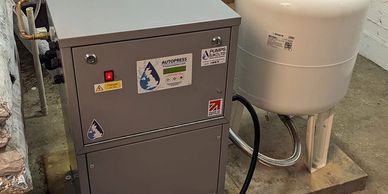 Sealed system pressurisation unit with expansion vessel for heating and cooling.