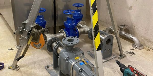 Installation of horizontal dry-well Concertor pumps using lifting gantry equipment.