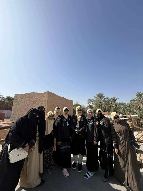 Group of women in hijabs and sunglasses outdoors