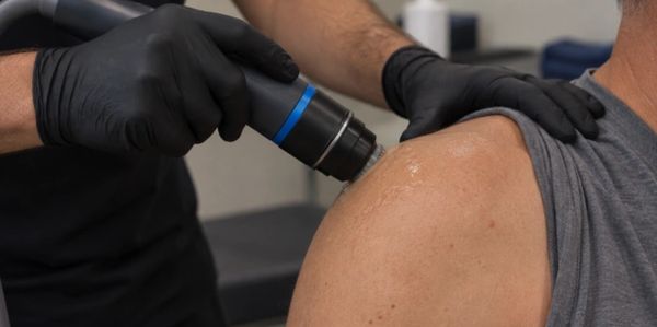 Therapeutic treatment on a person's shoulder.