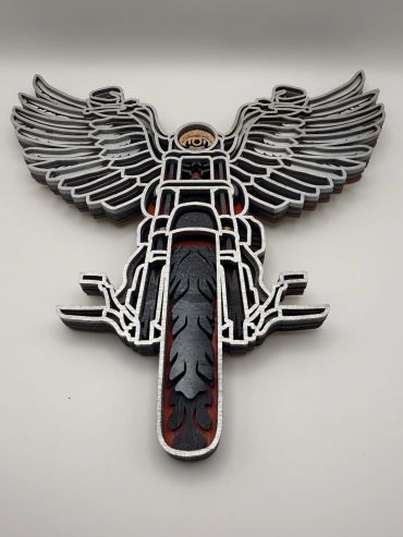 Wooden motorcycle with wings wall art.