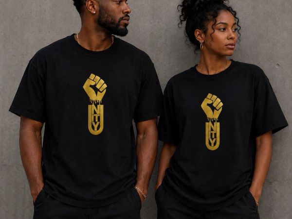 Two people wearing black shirts with gold unity fist logos.