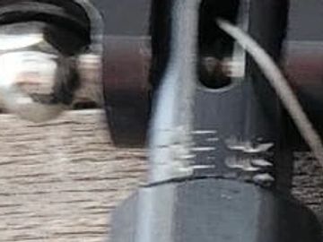 Close-up of a mechanical part with markings.