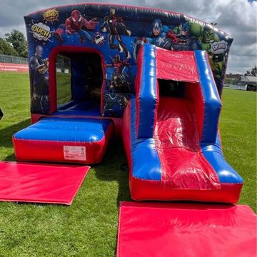 Red & Blue Superhero Bouncy castle with slide