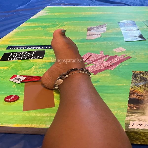 A sensual close-up of Goddess mango's pretty foot as she creates art on canvas.