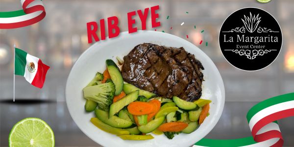 A grilled rib eye steak with mixed vegetables on a white plate.